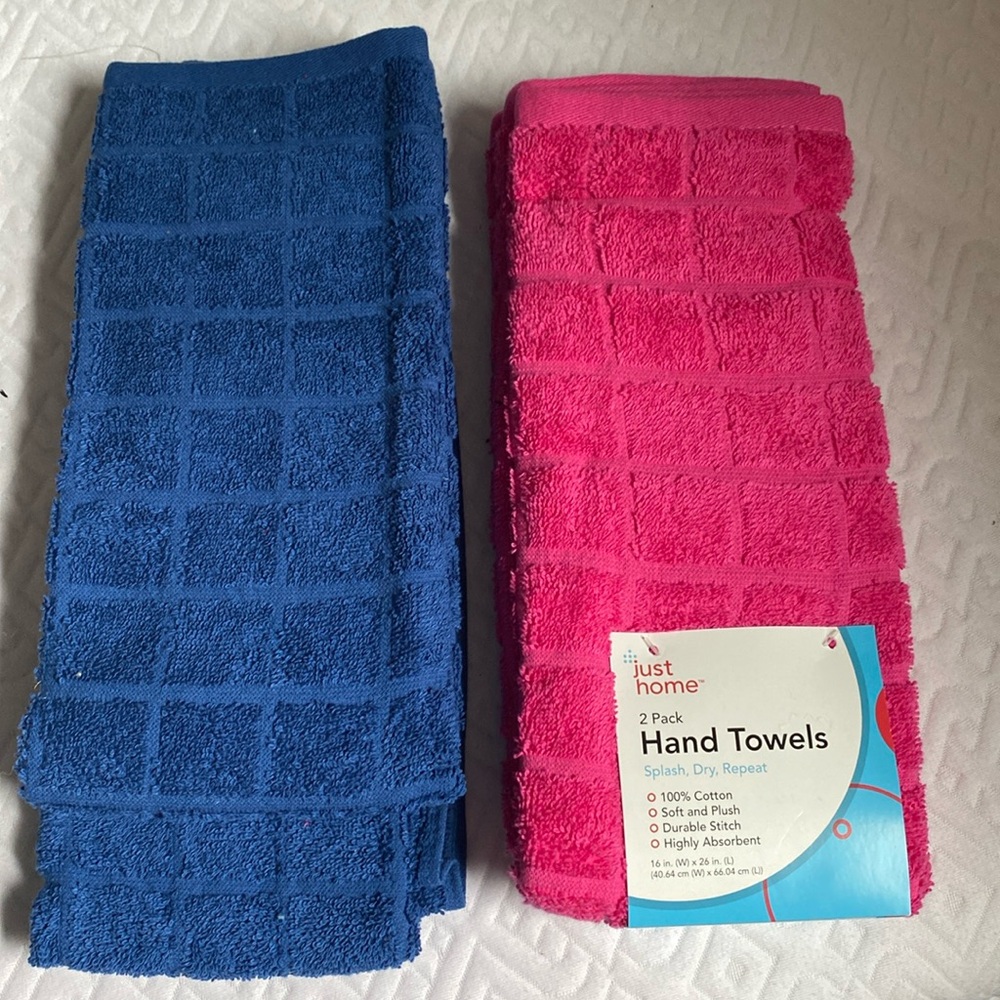 NWT two sets of 2 hand towels in navy and pink! 100% cotton! Smoke/pet FREE Home